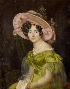 Retrato de Zinaida Volkonskaya con un vestido verde y un gran sombrero rosa.